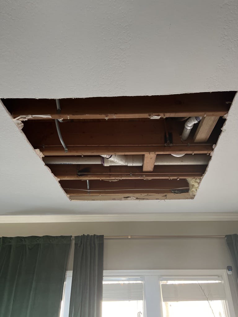 a giant whole cut into our ceiling